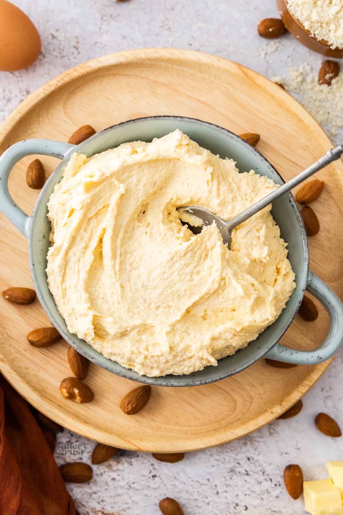 Top down view of a bowl filled with almond cream.