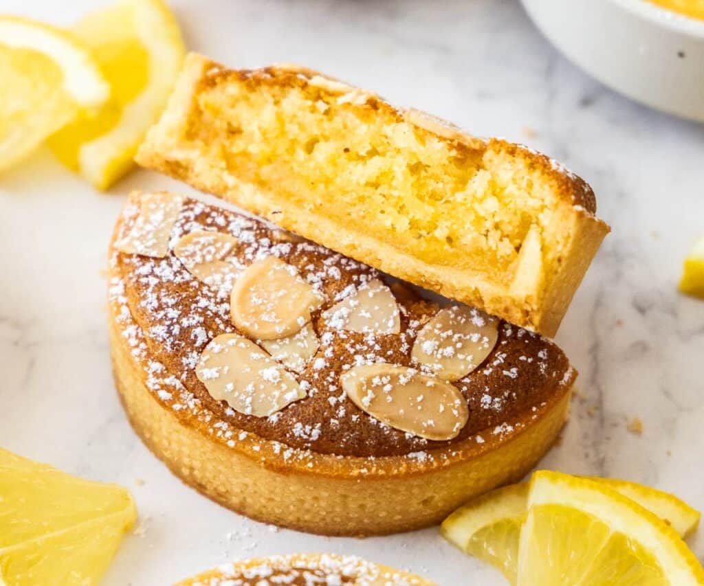 A baked frangipane tart showing the frangipane filling.