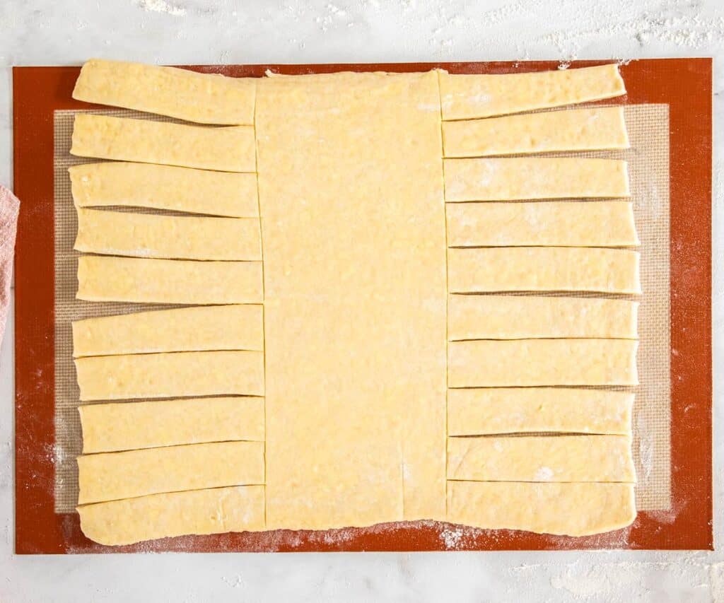 The Danish dough cut with strips on either side of a solid middle piece.