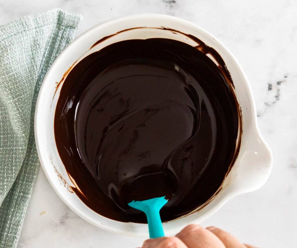 Mixing the glaze in a bowl.