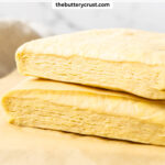 Two pieces of Danish pastry stacked and showing the layers inside.