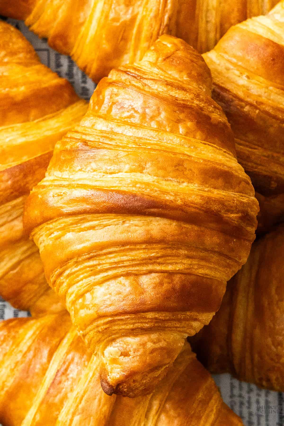 Extreme closeup of the top of a croissant.
