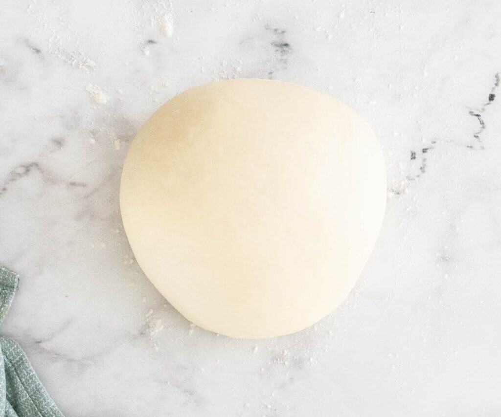A ball of croissant dough before adding butter.
