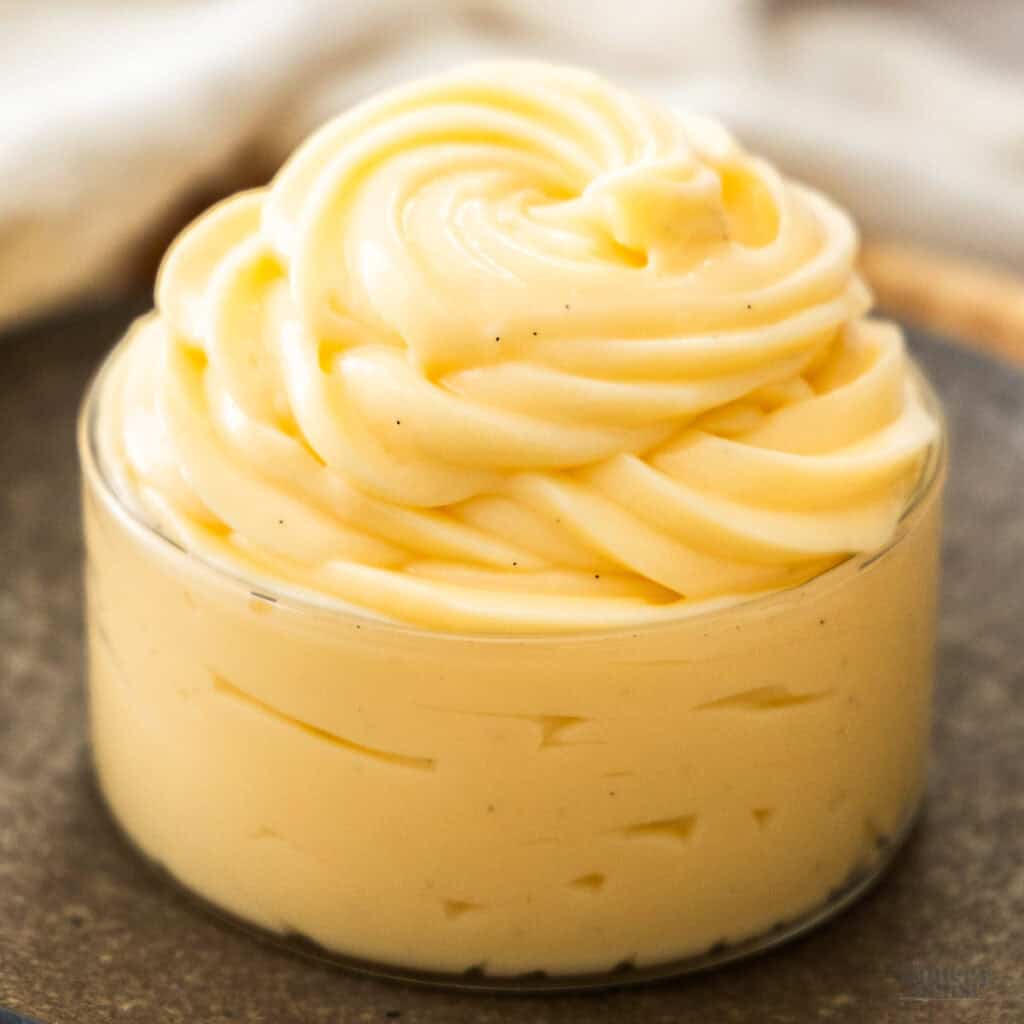 Extreme closeup of vanilla pastry cream in a glass.