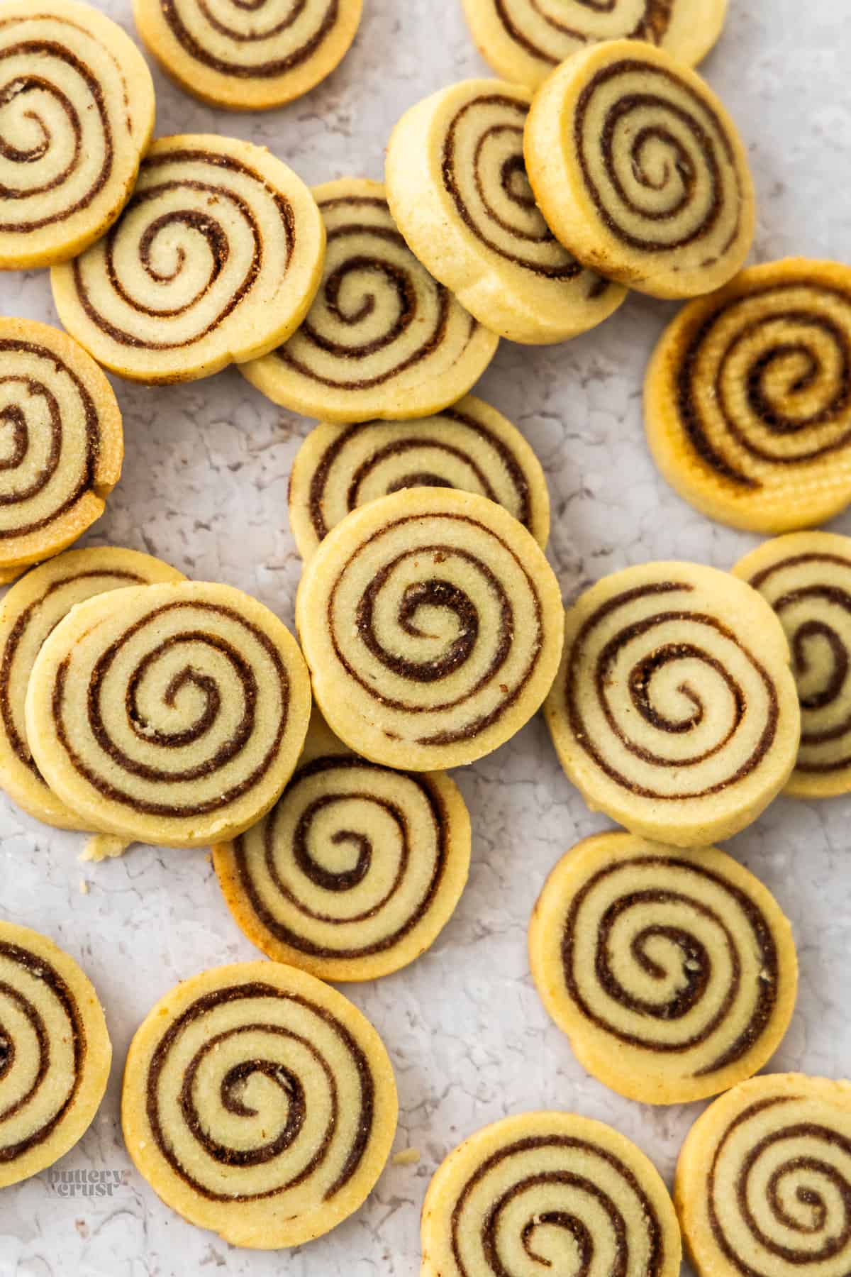 A batch of cinnamon roll cookies made using scraps of pate sablee dough.