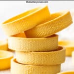 A stack of 5 pâte sablée tart shells.