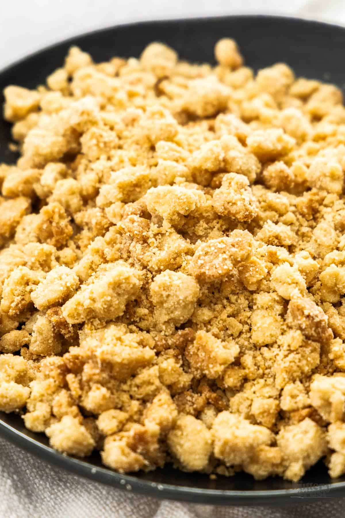 Closeup of crumble topping on a plate.