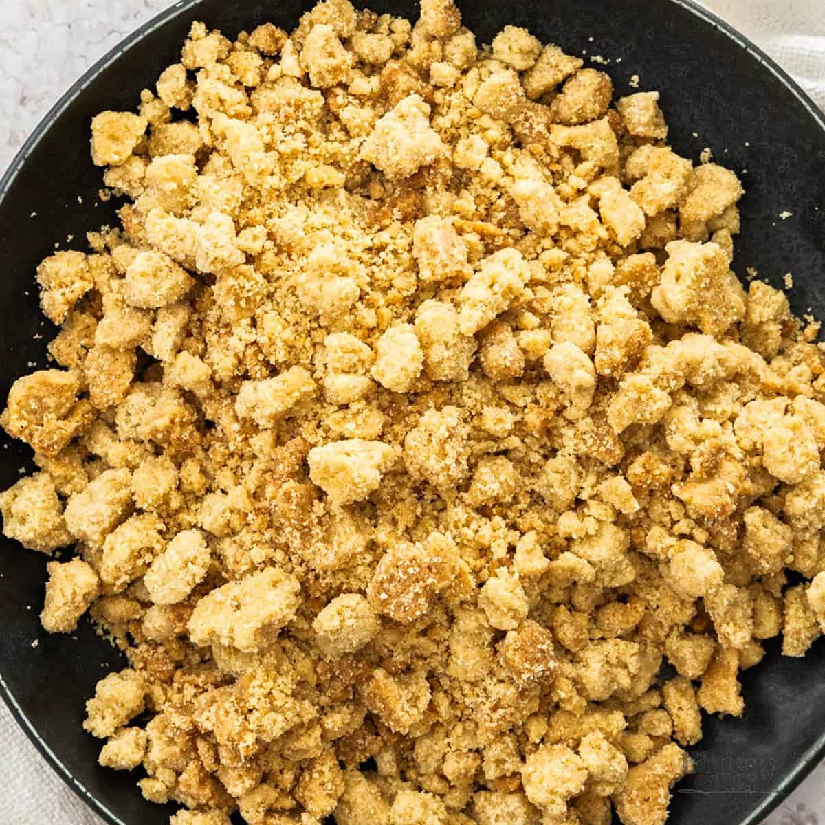 Top down view of crumble topping on a plate.