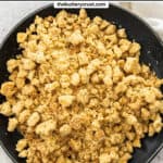 Top down view of crumble topping on a plate.