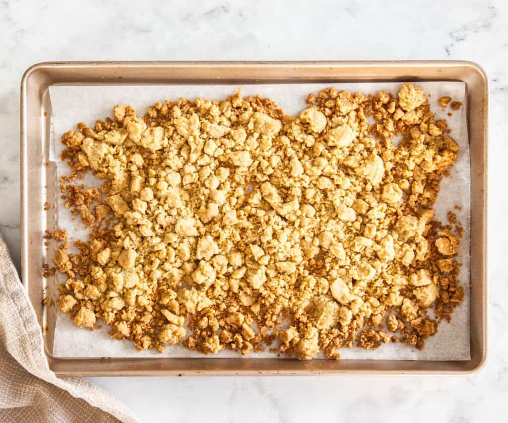 Baked crumble topping on a baking sheet.