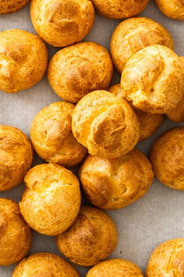Top down view of a batch of choux buns.