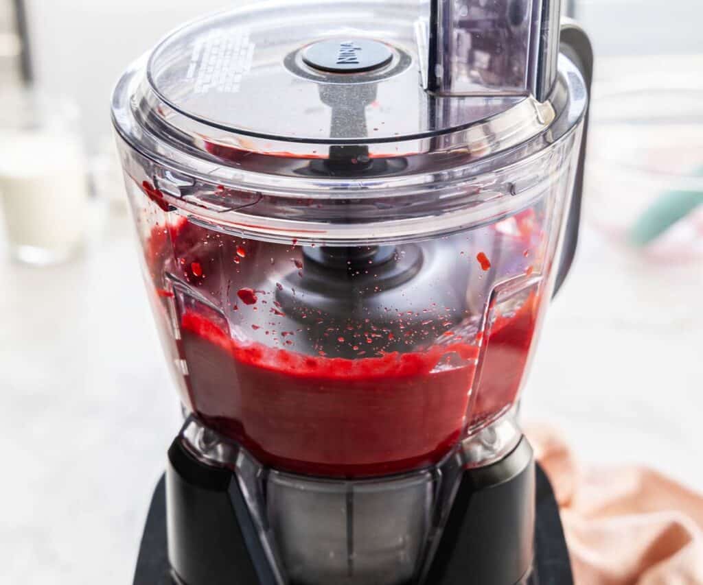 Raspberry puree in a food processor.