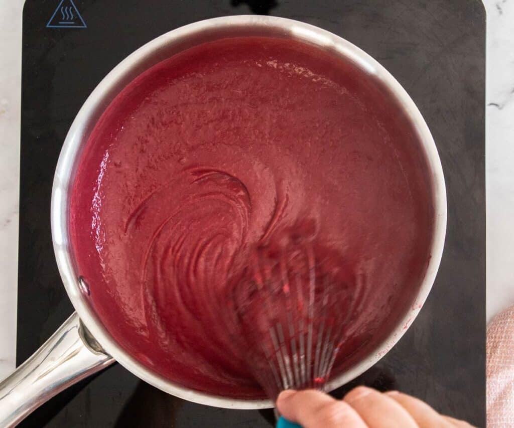 The raspberry pastry cream in a saucepan.