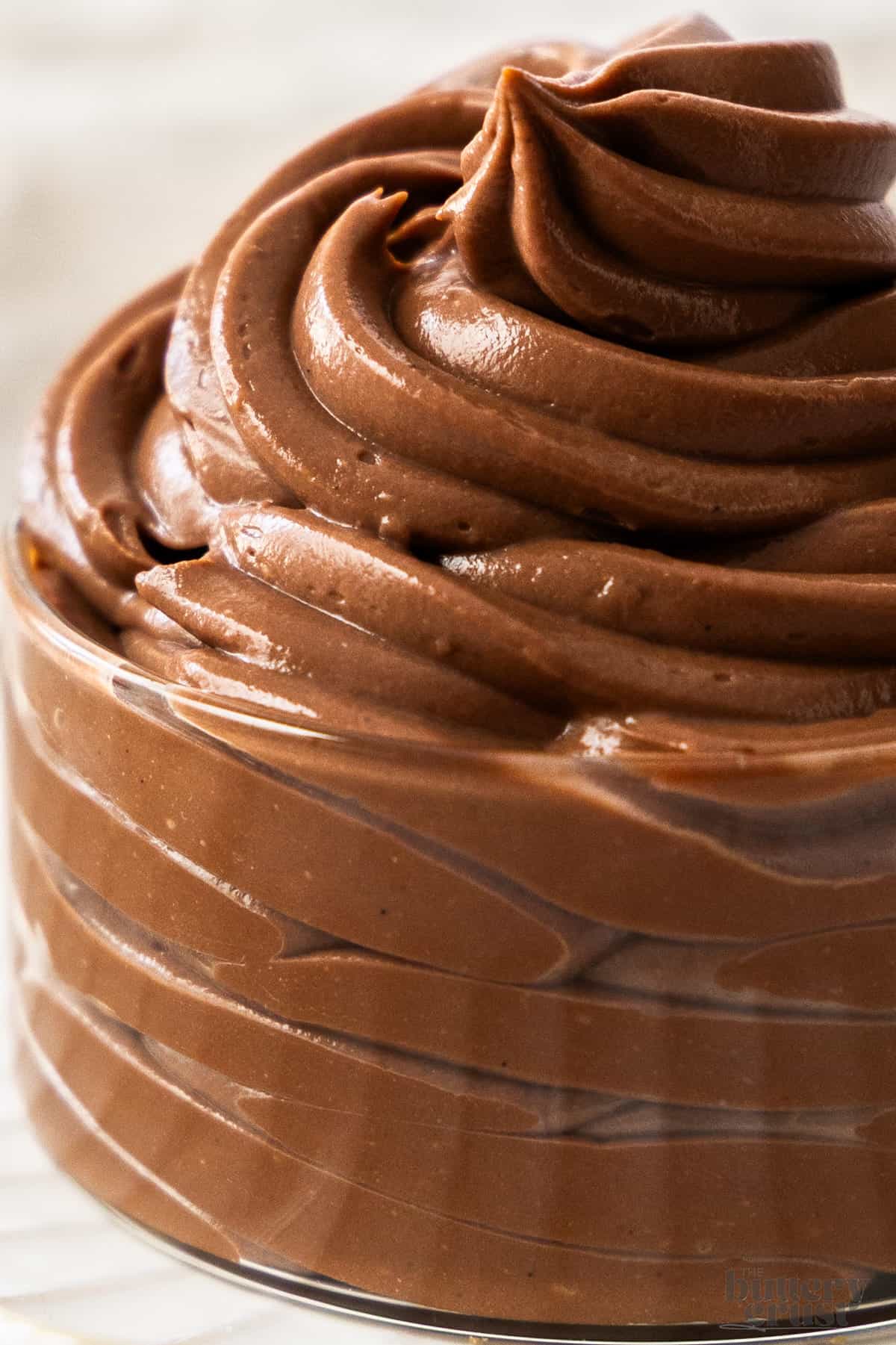 Extreme closeup of the swirl of chocolate creme patissiere.