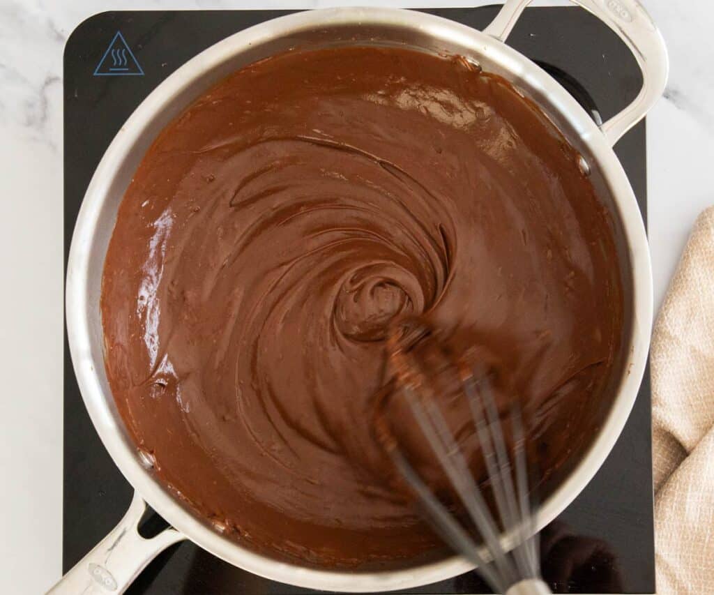 The chocolate being whisked into the pastry cream base.