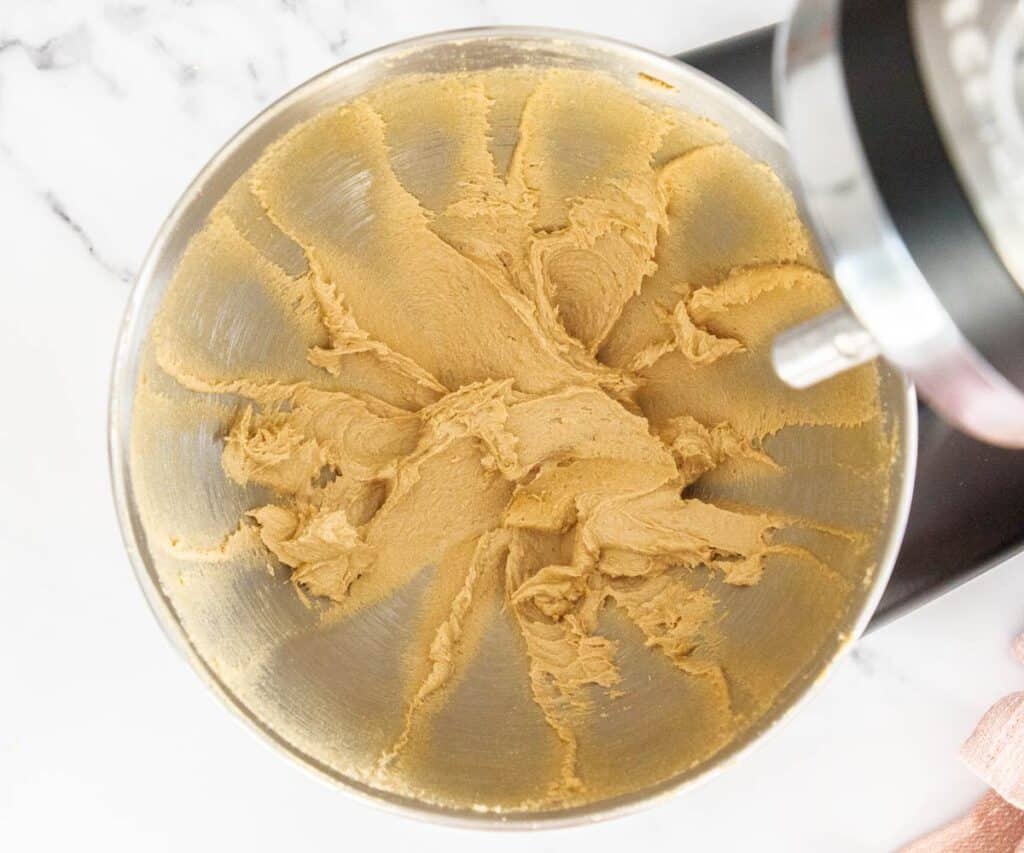Butter and brown sugar beaten together in a stand mixer bowl.