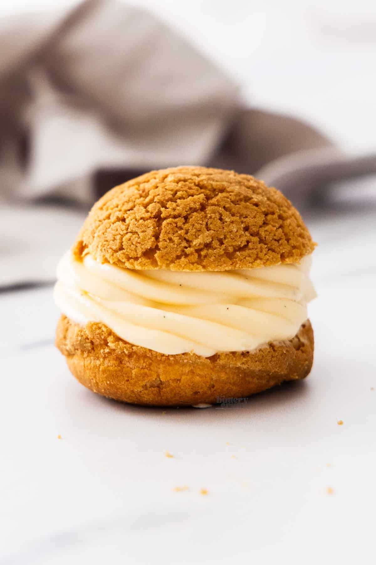 A small choux bun with creme legere piped inside.