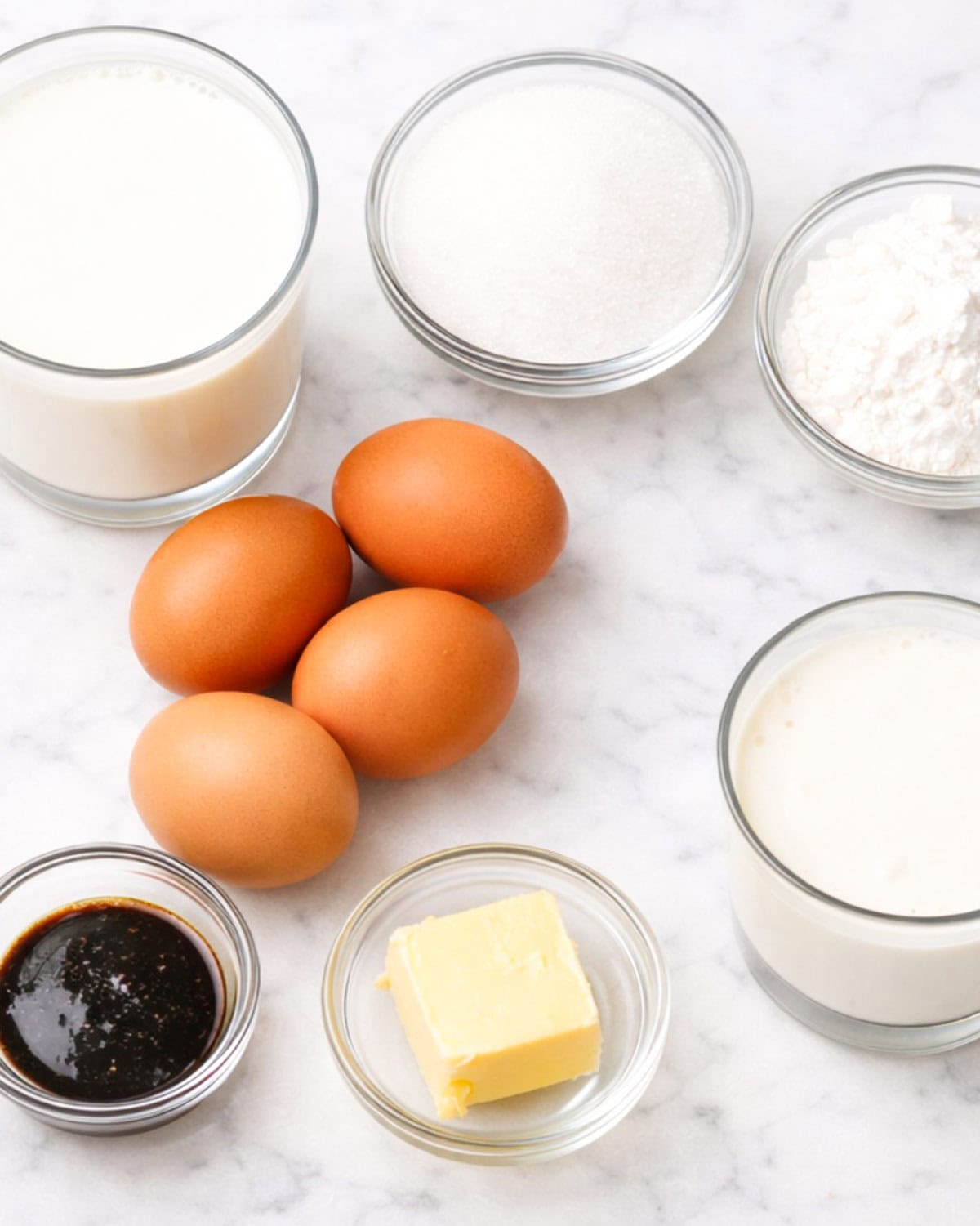 Ingredients for creme legere on a marble surface.