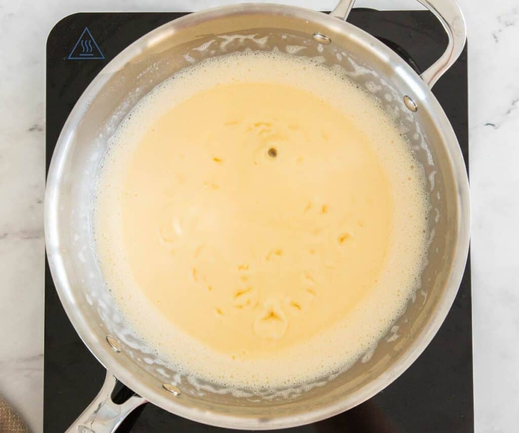 The pastry cream bubbling in a pan.