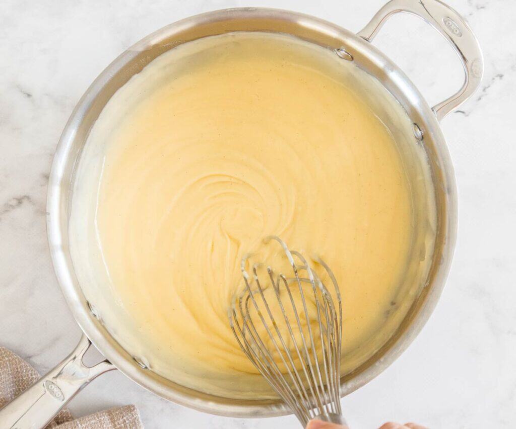 The pastry cream thickened in a saucepan.