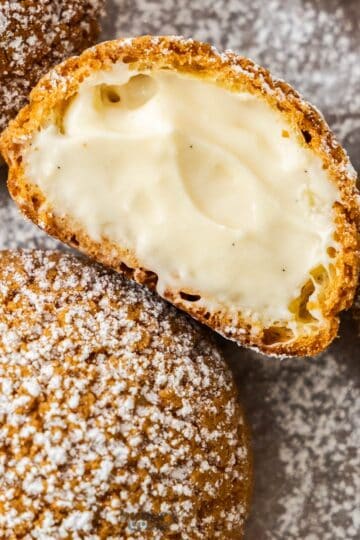 Closeup of the filling and craquelin edge of a choux a la creme.