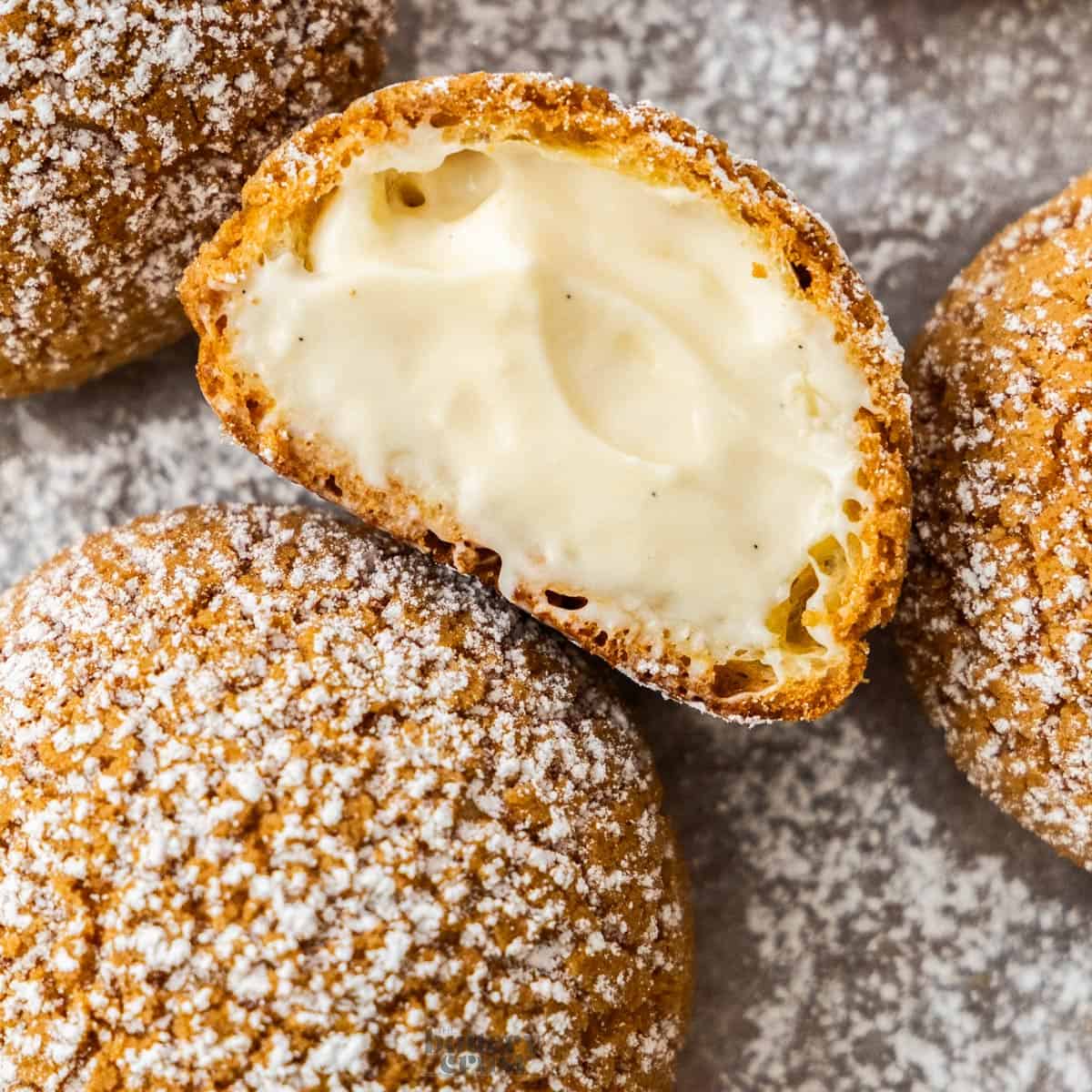 Closeup of the filling and craquelin edge of a choux a la creme.