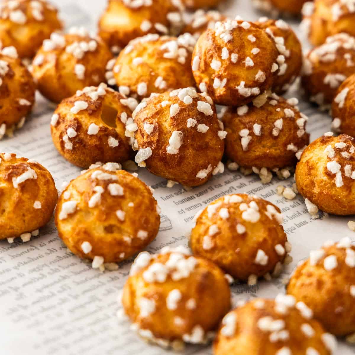 Closeup of a batch of chouquettes.