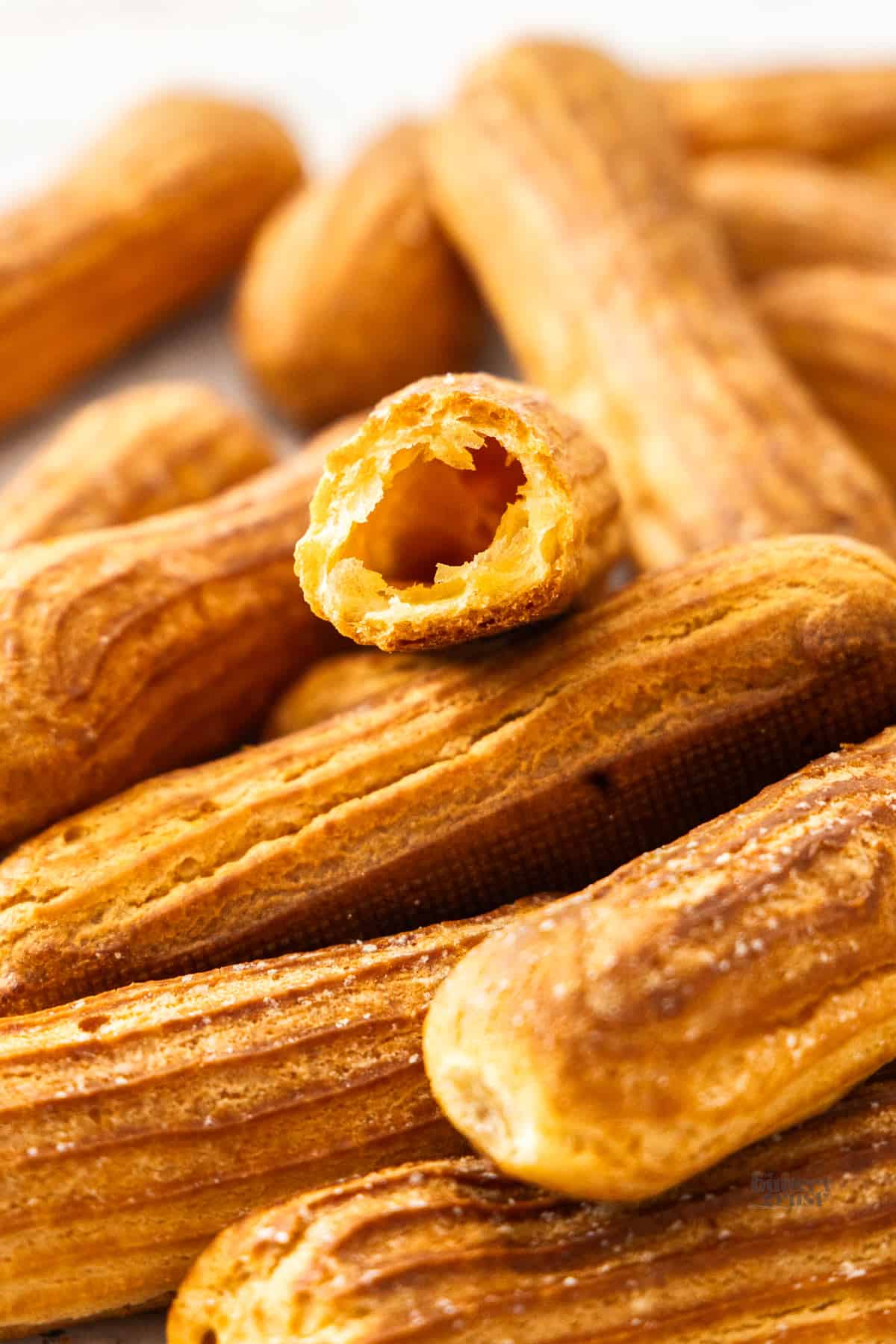 The inside of an eclair pastry showing the hollow centre.