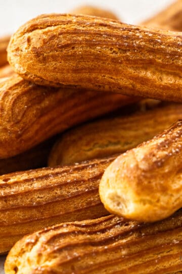 Closeup of a pile of eclairs.