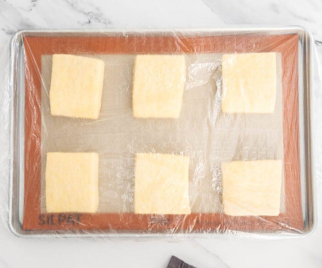 The squares of pastry after proofing for 1 hour.