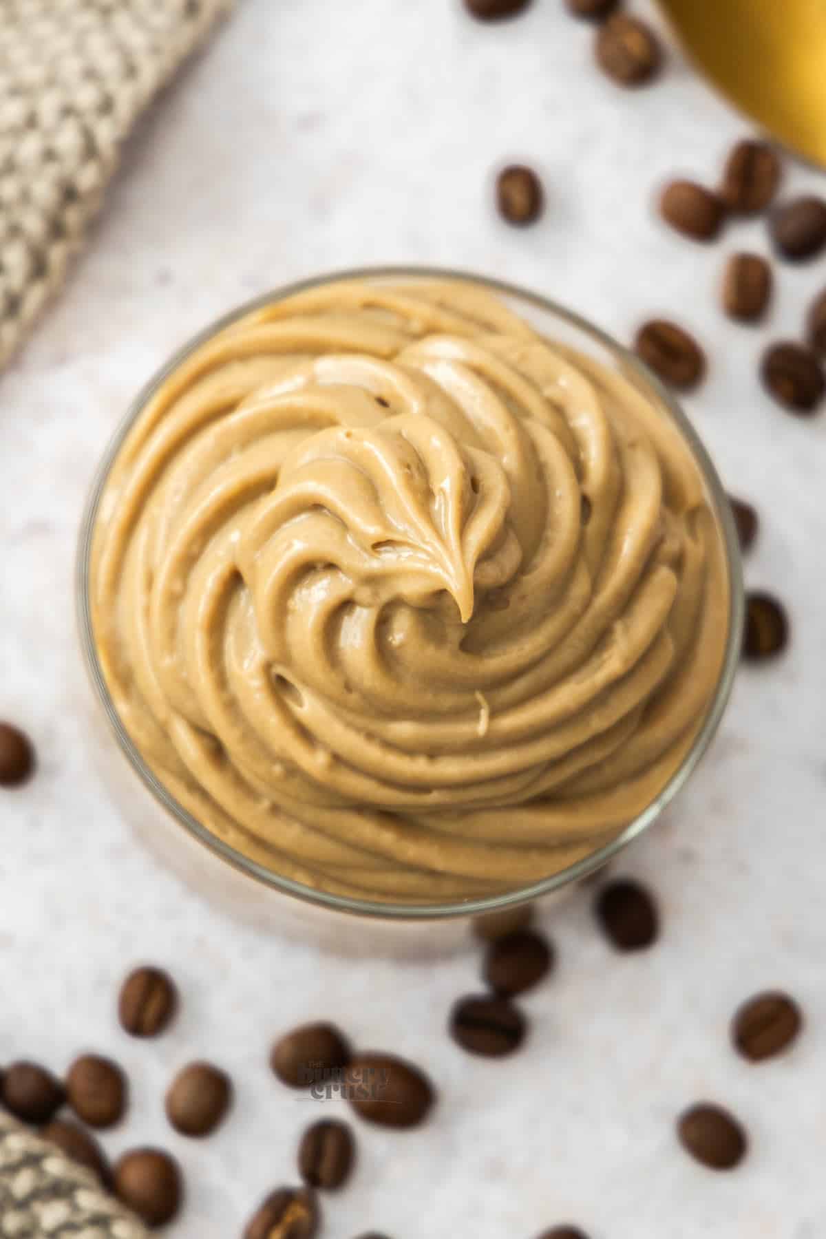 Top down view of a big swirl of espresso pastry cream.