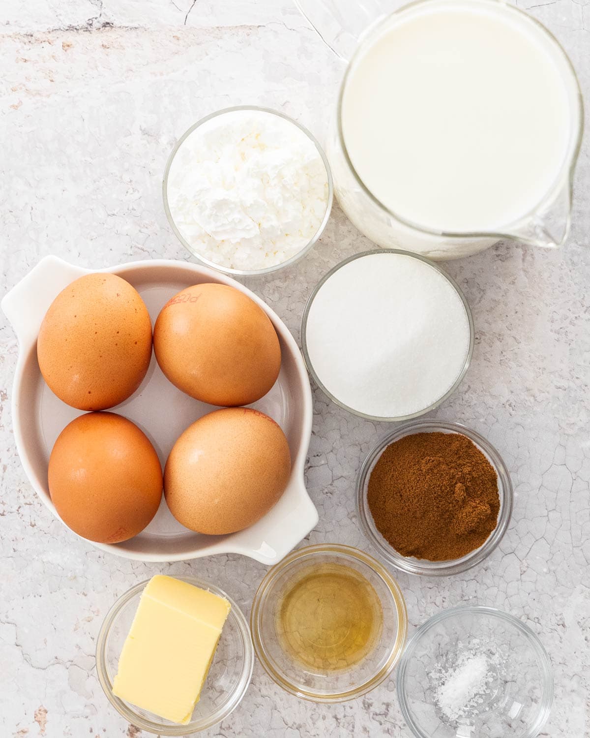 Ingredients for coffee pastry cream on a concrete surface.