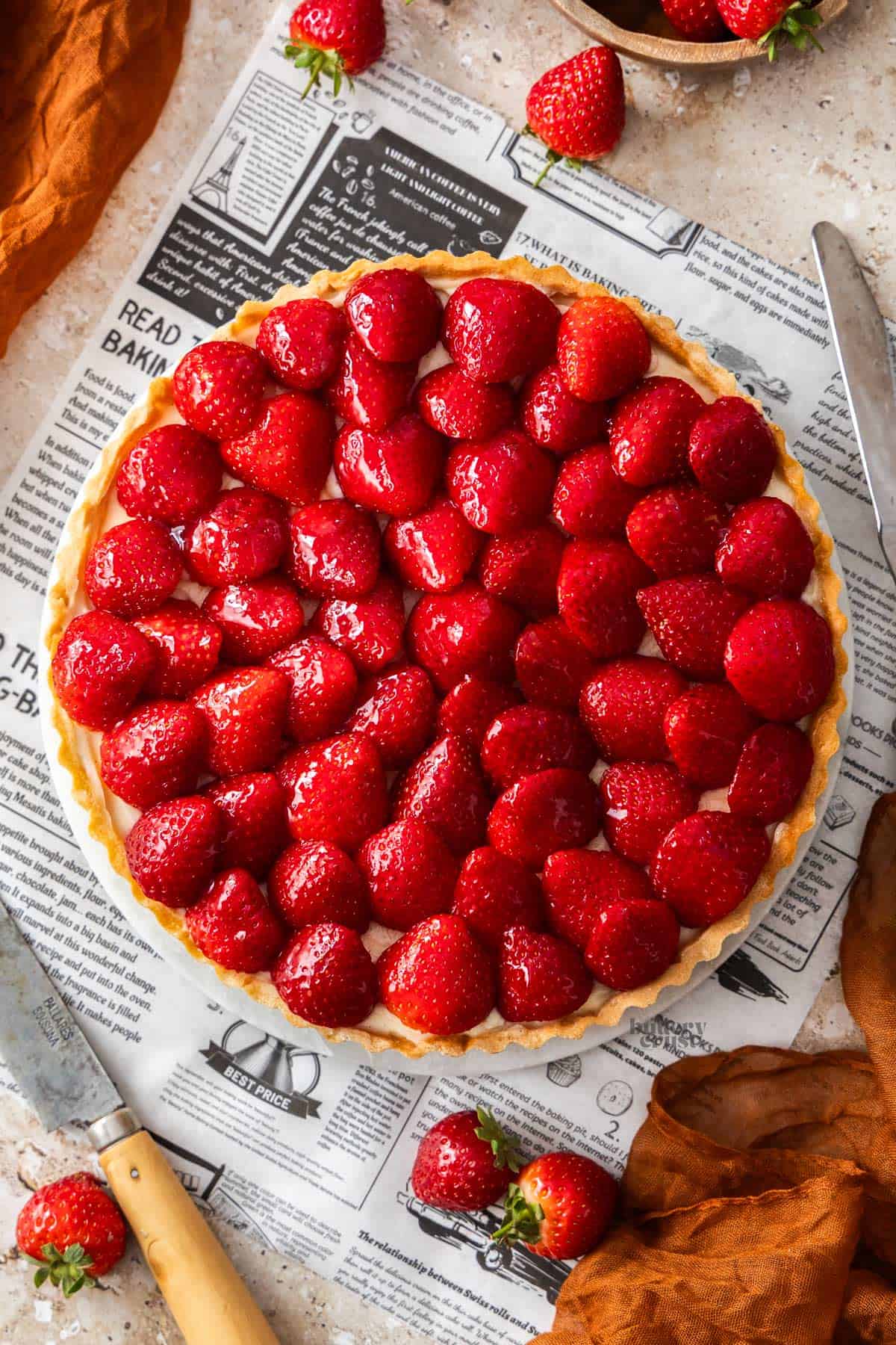 Top down view of a whole strawberry tart.