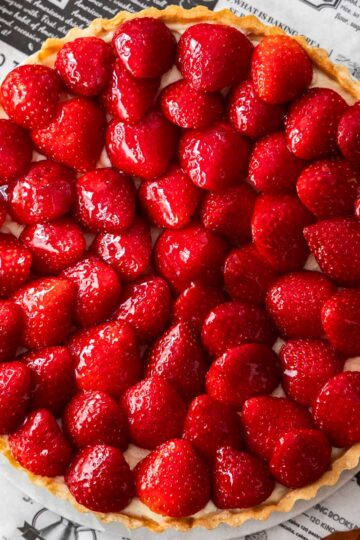 Top down view of a whole strawberry tart.