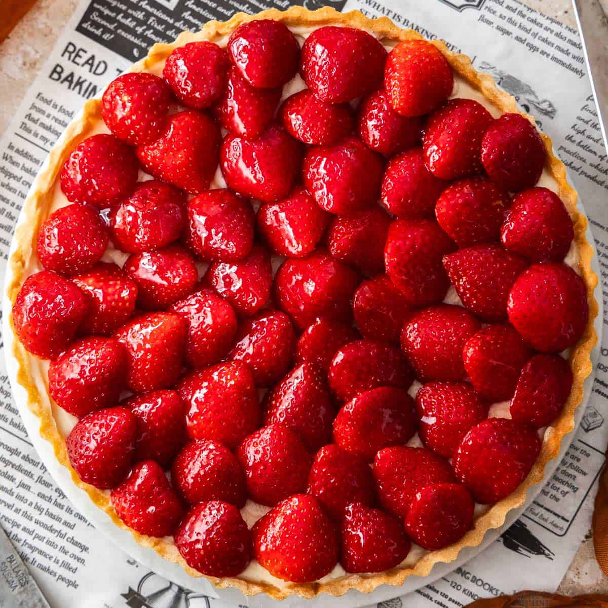Top down view of a whole strawberry tart.