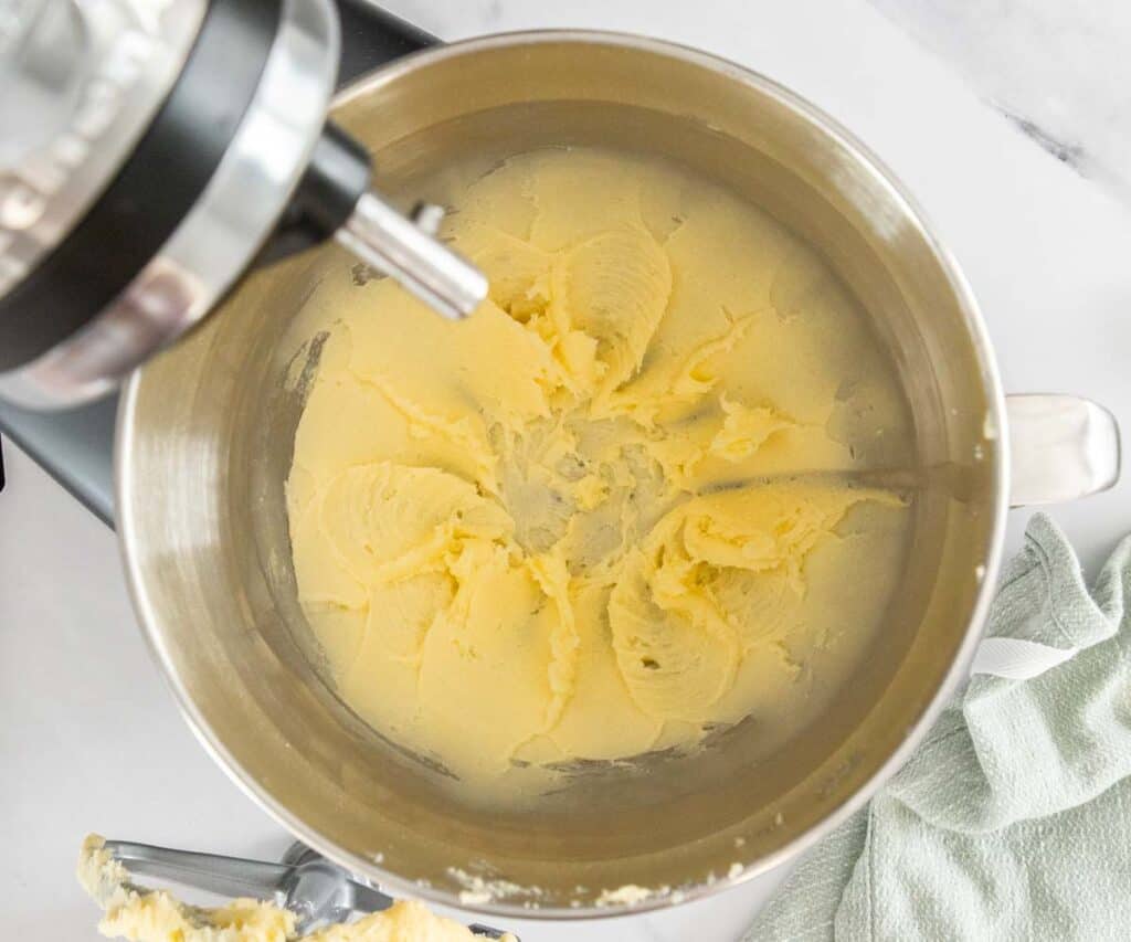 The butter and sugar beaten together in a mixing bowl.
