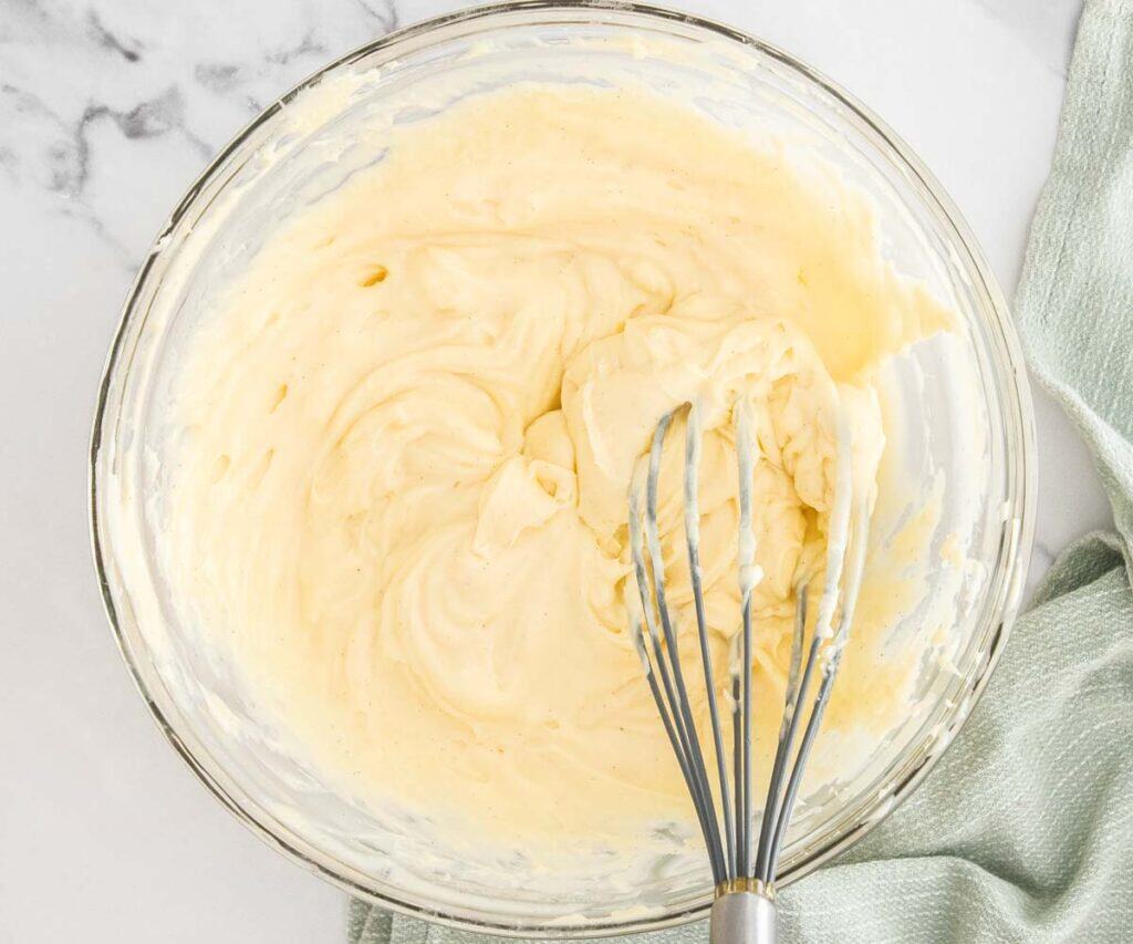 The pastry cream re-whipped in a glass bowl, ready to use in the tart.
