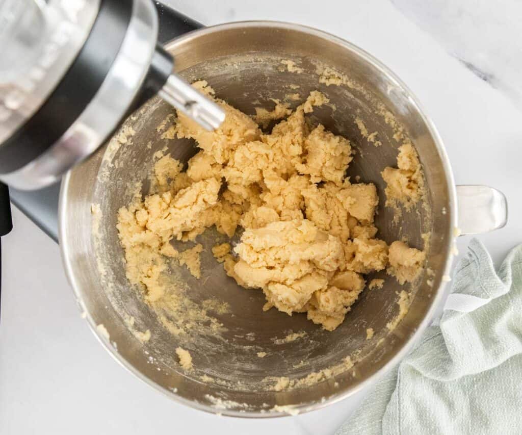 The pate sucree pastry dough in a mixing bowl.