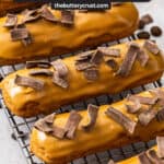 Closeup of 5 coffee eclairs.