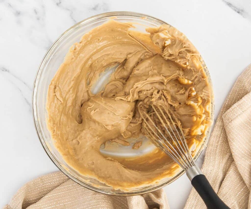 The coffee pastry cream re-whipped in a mixing bowl.
