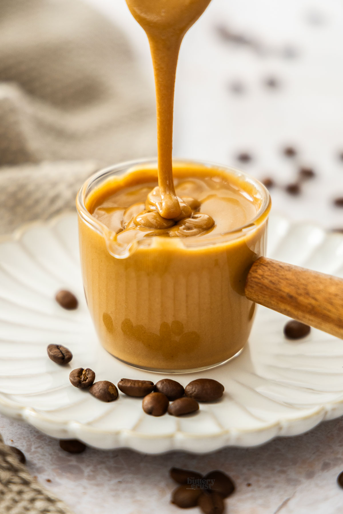 Coffee Glaze being drizzled into a glass.