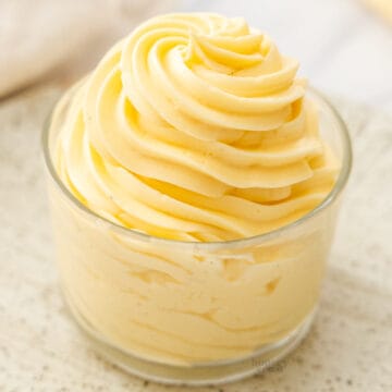 Mousseline cream piped in a swirl into a glass.