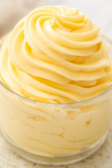 Mousseline cream piped in a swirl into a glass.