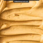 Top-down view of a tray of praline cream swirled with a spatula.