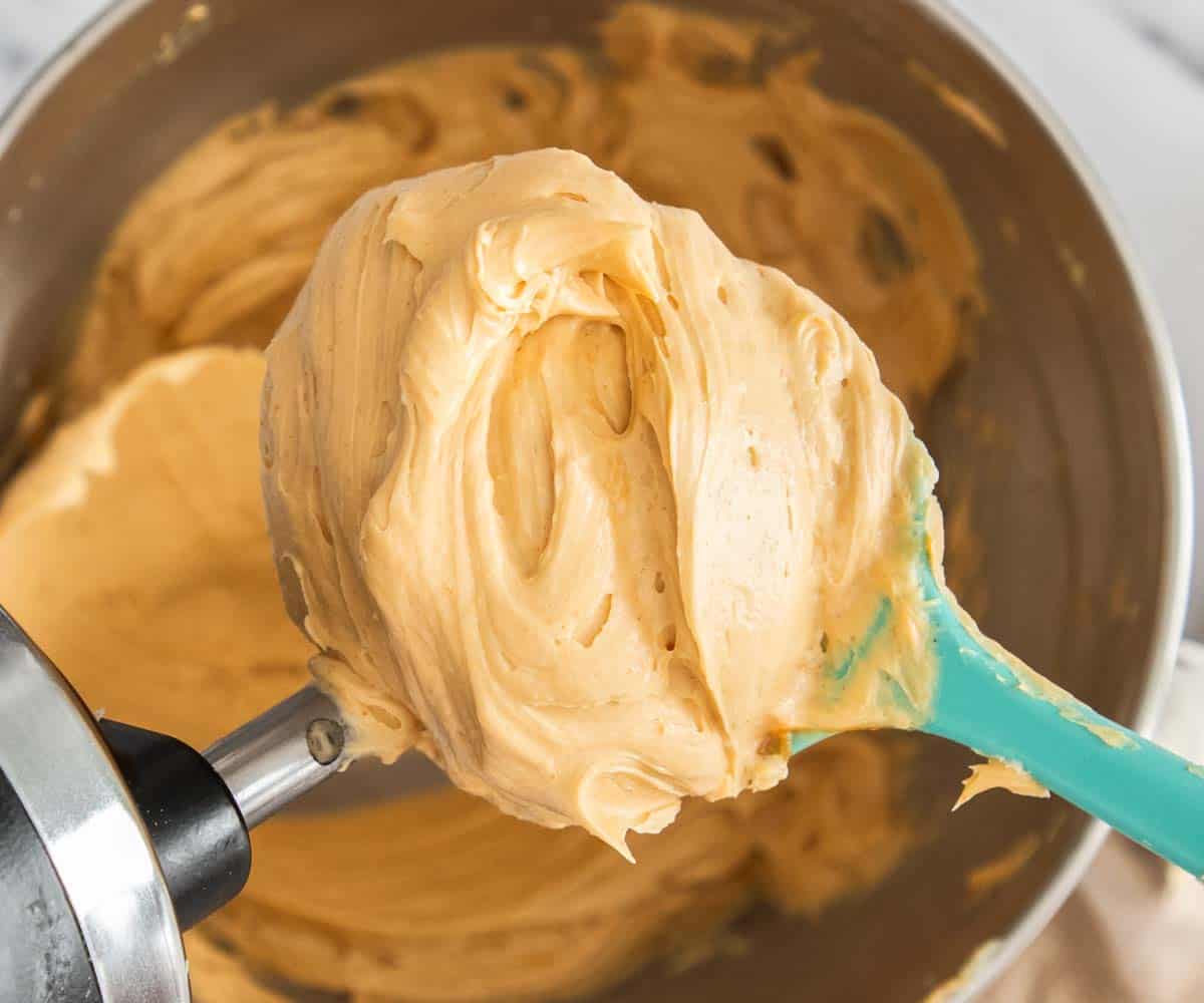 The praline mousseline cream on a spatula.