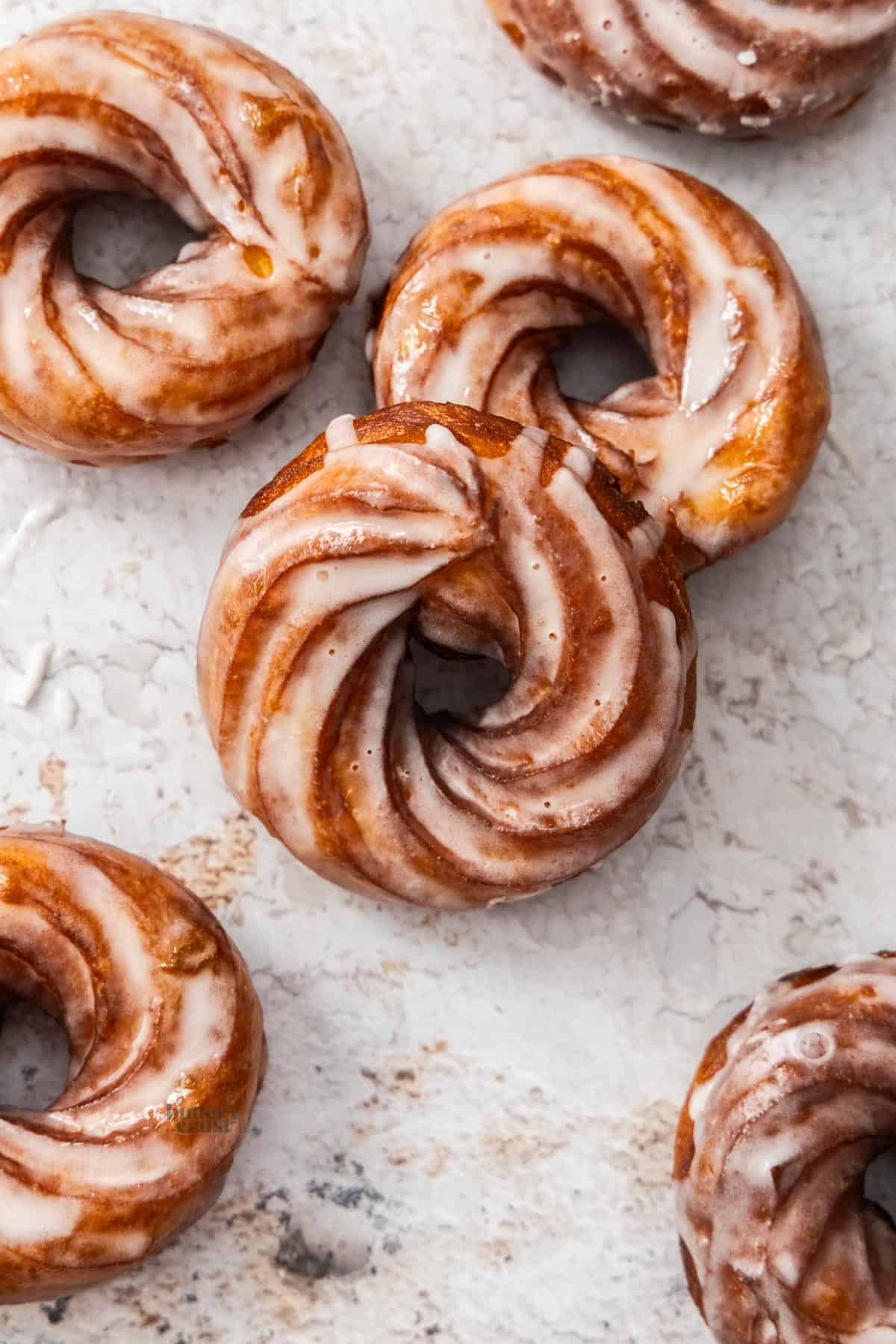 Top down view of a batch of French crullers.