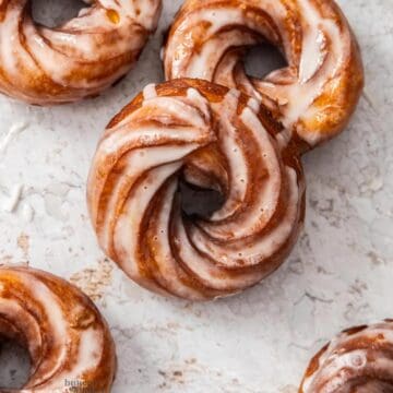 Top down view of 5 French crullers.