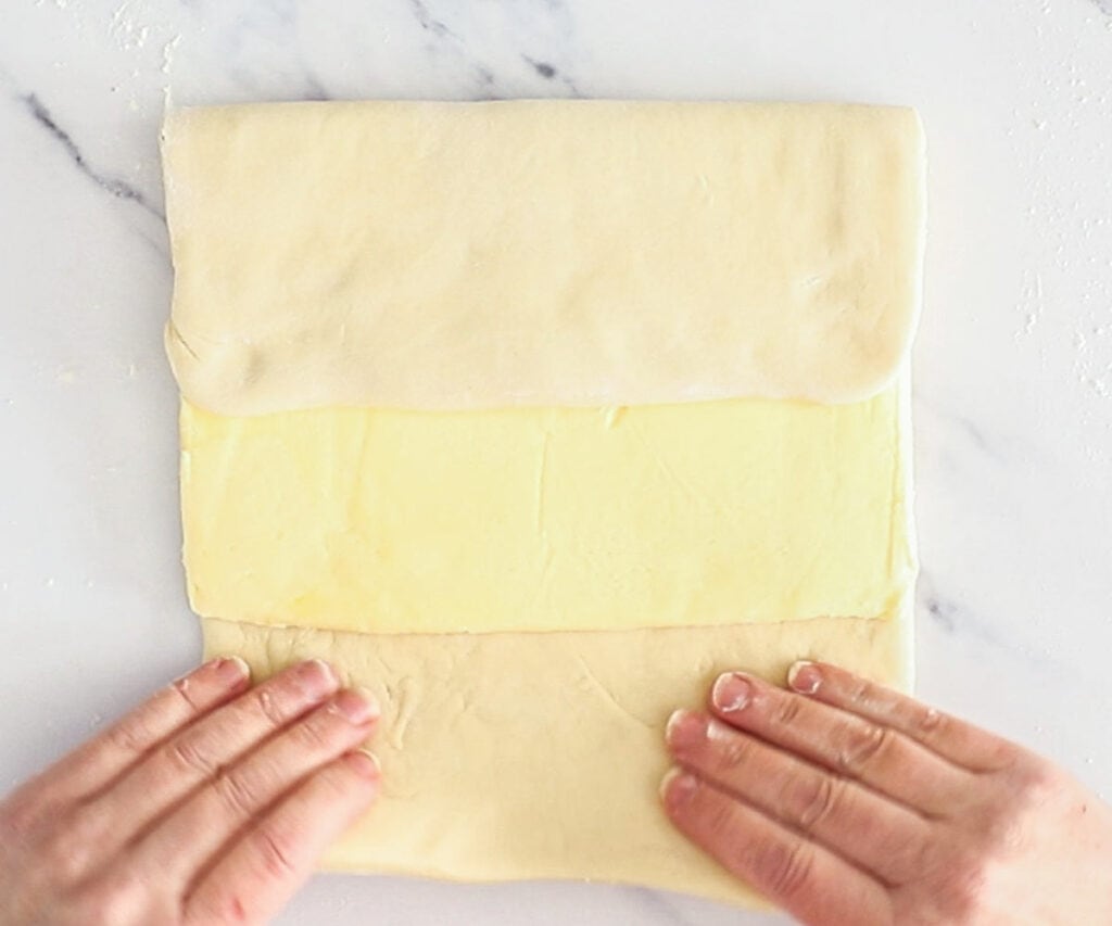 Folding the butter inside the dough.