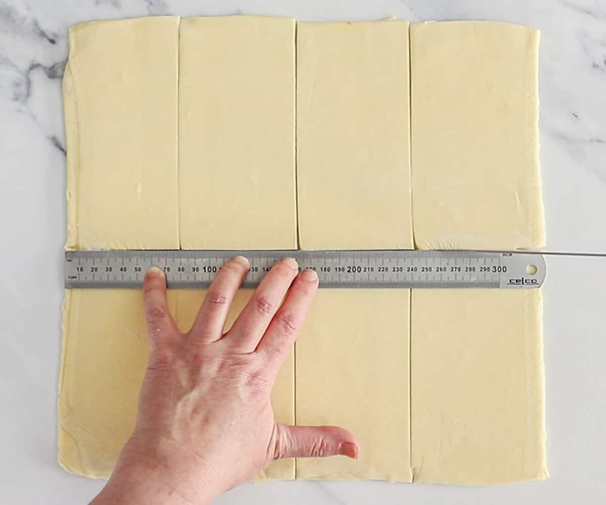The dough being cut into 8 portions.