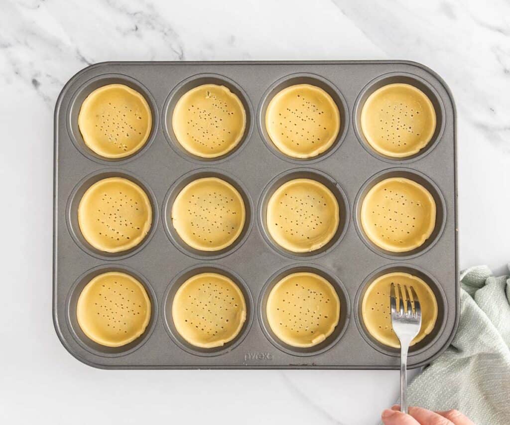 Pastry in a muffin pan to make mini tart shells.